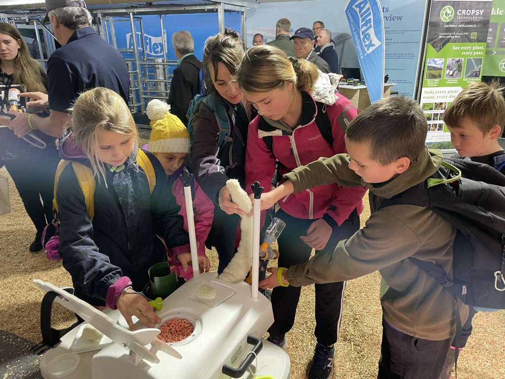 Kiwi Children Learning to use Numnuts at Fieldays NZ Innovation Tent